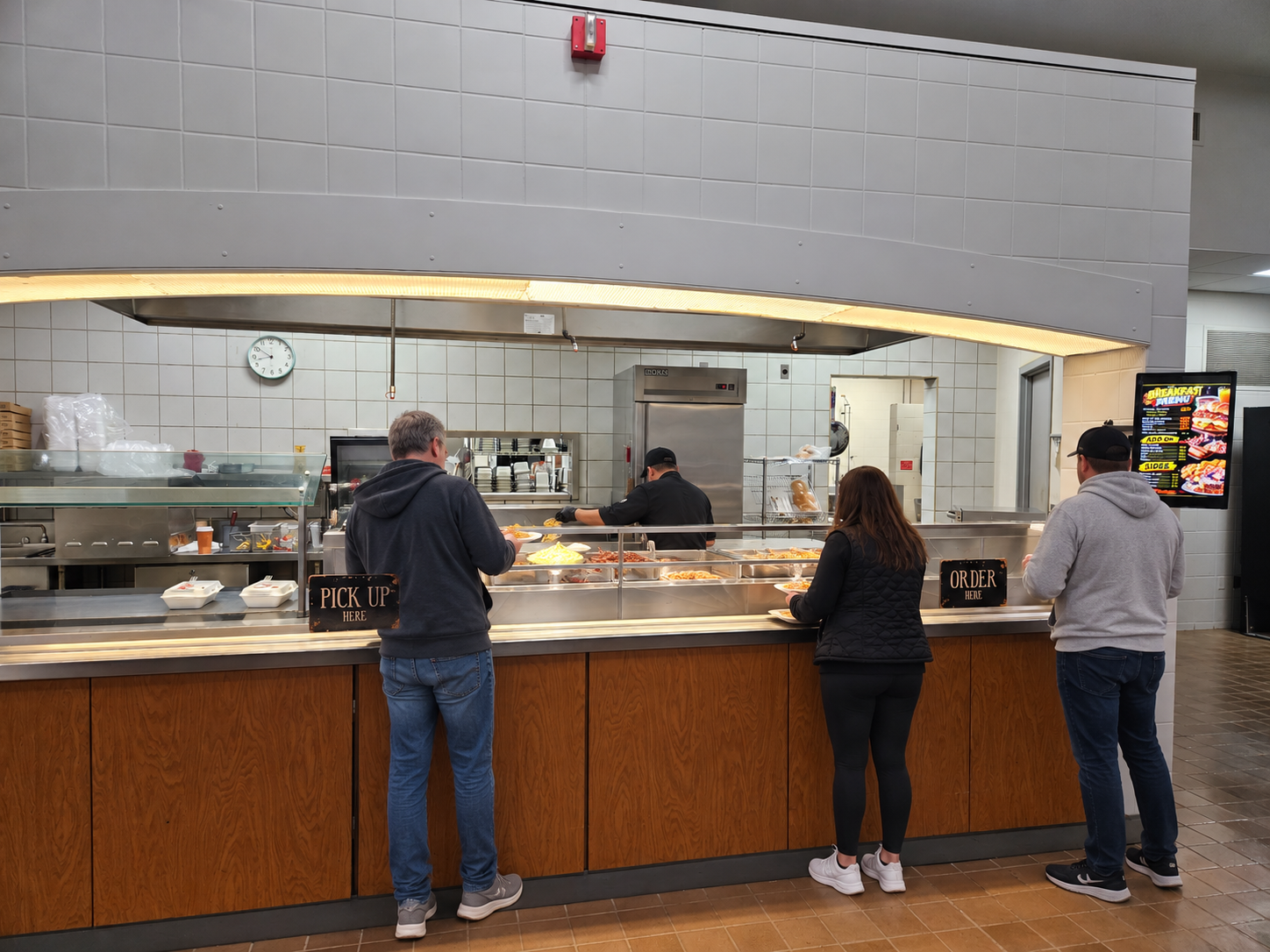 Campus cafeteria breakfast line with serving counter